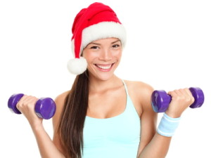 Christmas fitness woman wearing santa hat